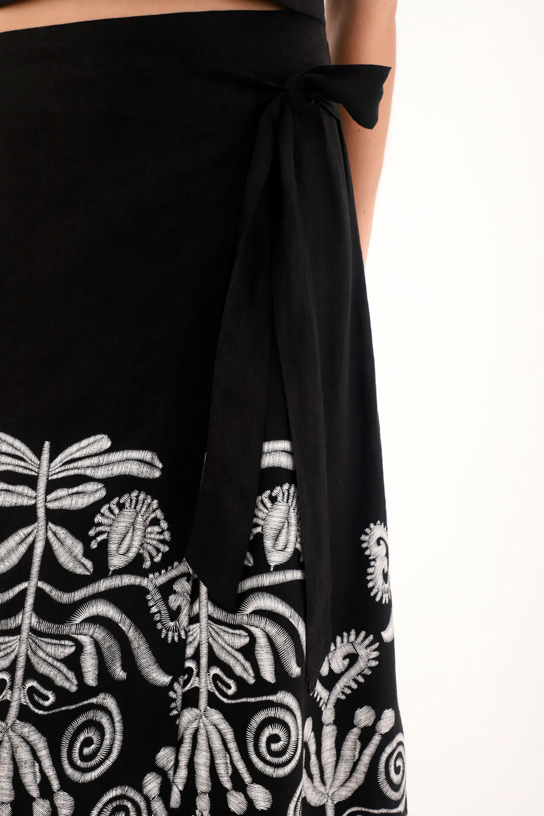 Women's black long pareo skirt with embroidered imitation