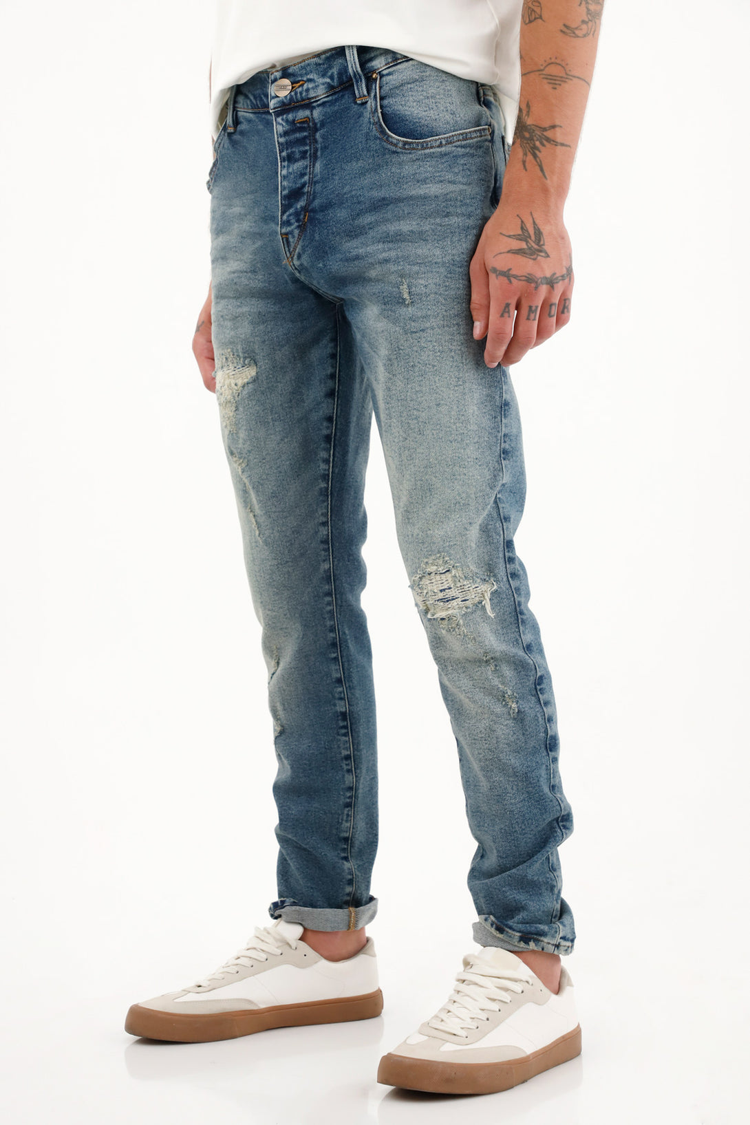 Jean Skinny tiro medio con rotos para hombre