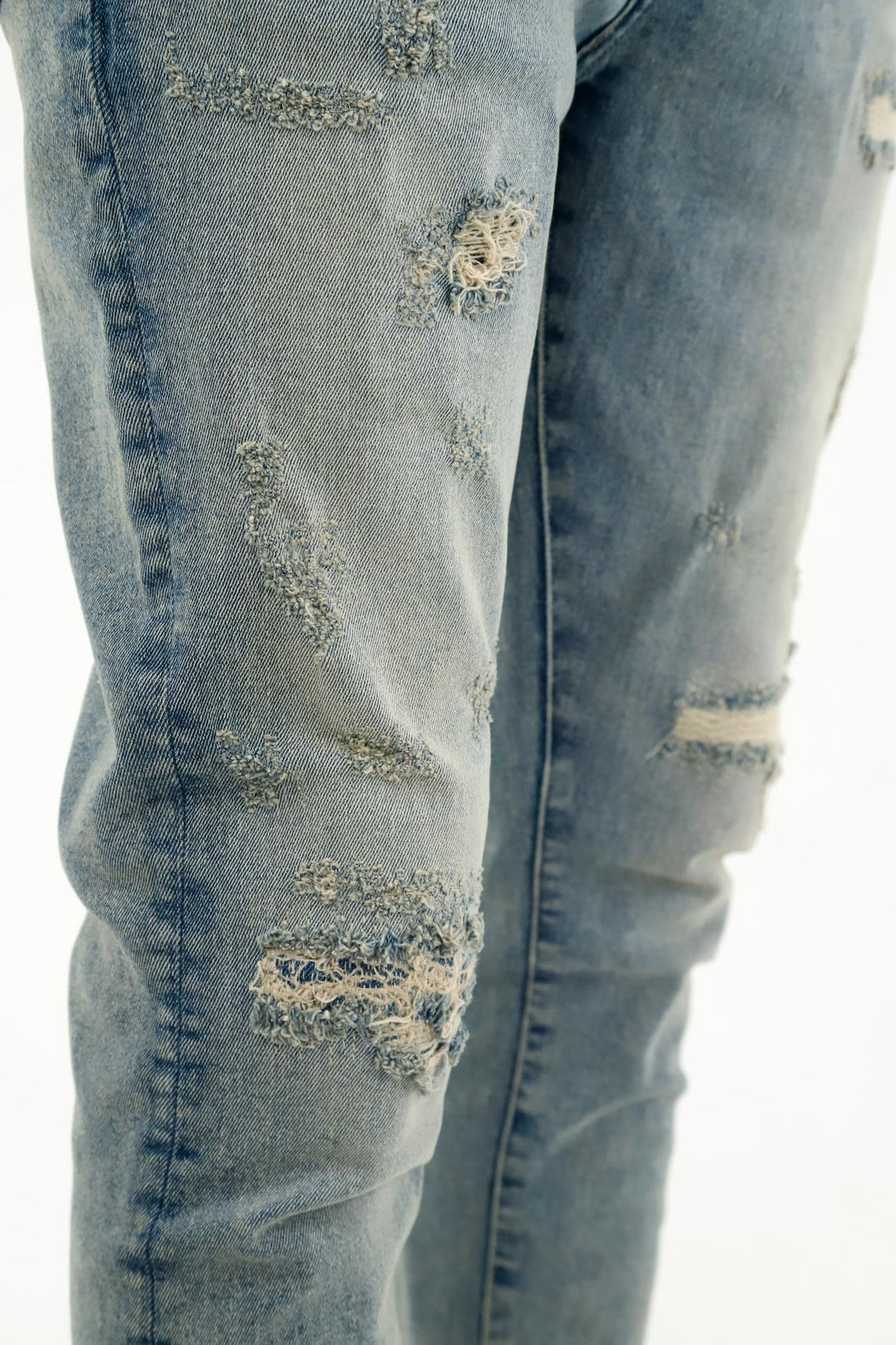 Men's Ripped and Distressed Blue Jeans