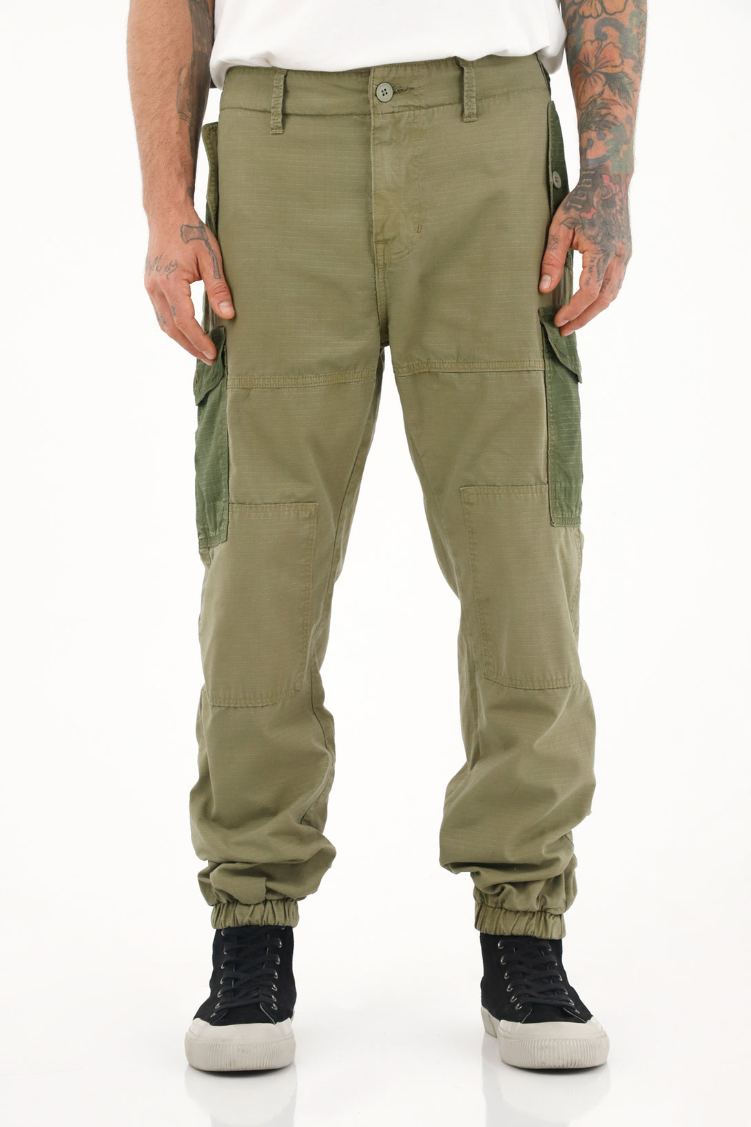 Men's green patchwork pants with cuffed hems