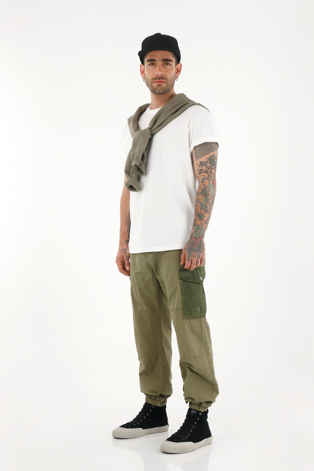 Men's green patchwork pants with cuffed hems