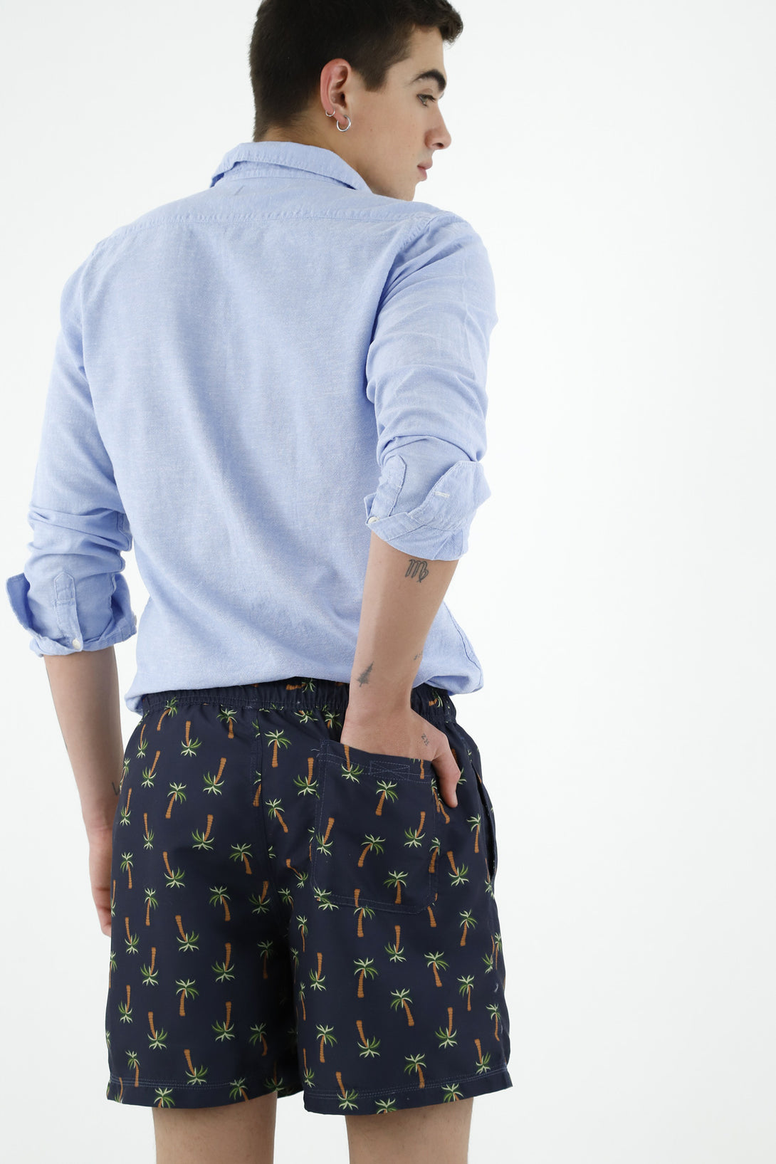 Pantaloneta de baño azul estampado palmeras