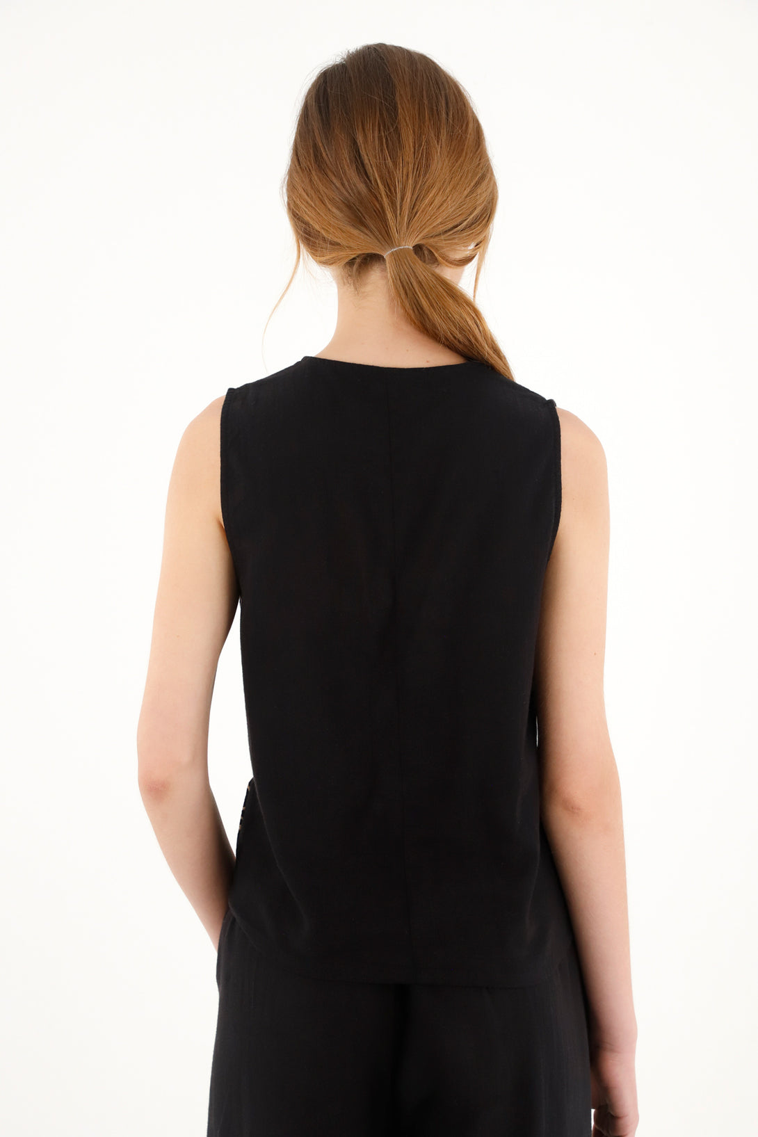 Women's black vest with embroidered hem